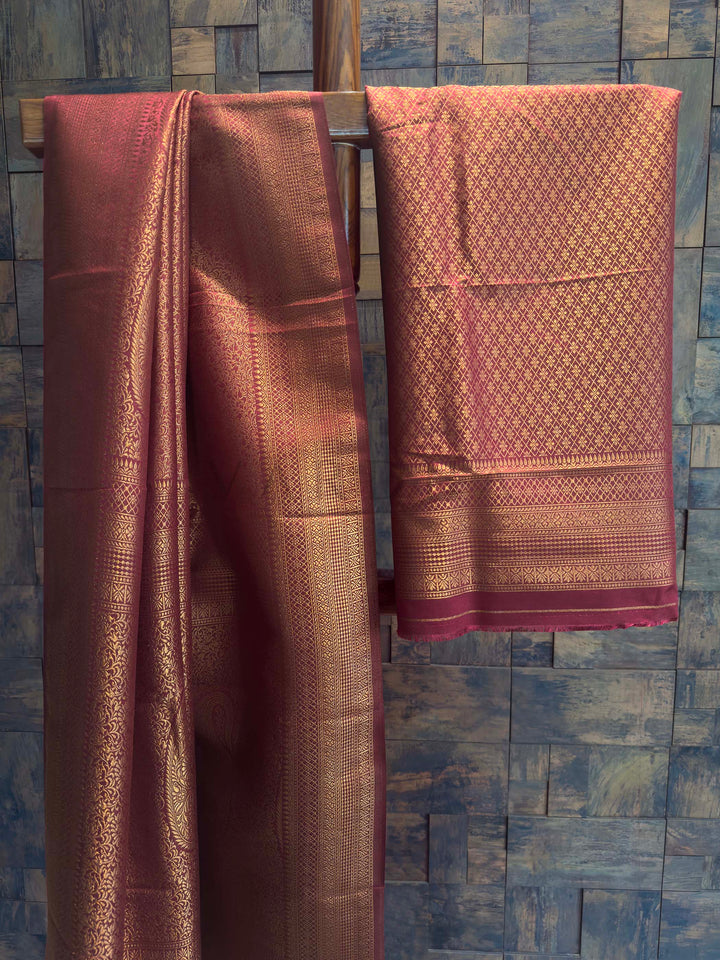 Maroon Golden Zari Kanjivaram Silk Saree House of Vardha. Authentic Indian ethnic wear featuring a striking Maroon Golden Zari Kanjivaram Silk Saree richly woven with golden threads to create a luxurious look by House of Vardha. We offer Ready to wear, Pre drape service, Saree Add on, Custom Stitched Blouse, Fall and Edging, Gift Packaging at Complimentary Price!