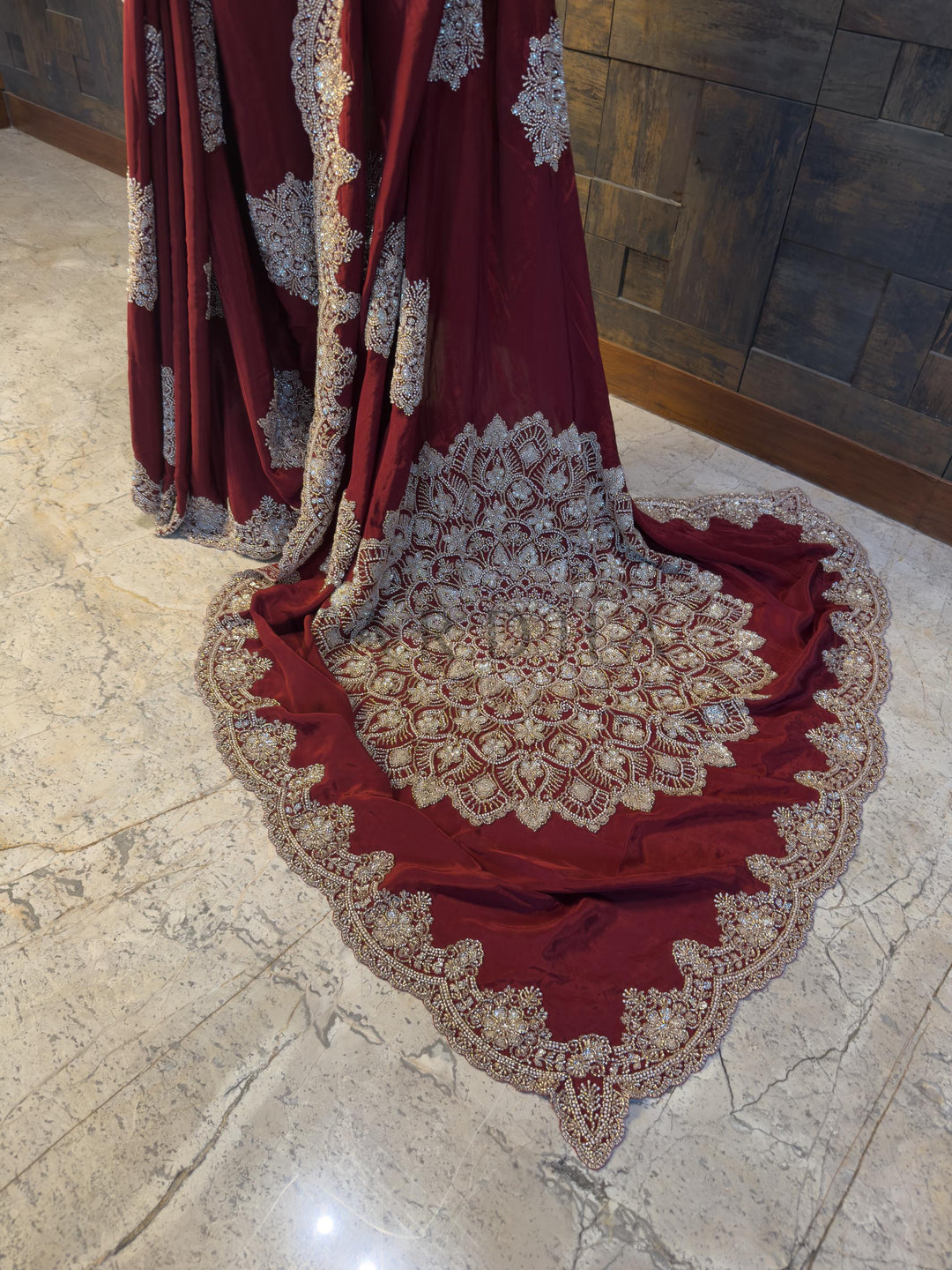 Massive Hand Embroidered Mandala Pallu on Satin Crepe Party Saree. Luxurious Maroon festive Satin Crepe Saree by House of Vardha with radiant Silver Cutdana &amp; Beads Handwork, perfect for evening parties and special occasions. We offer Ready to wear, Pre drape service, Saree Add on, Custom Stitched Blouse, Fall and Edging, Gift Packaging at Complimentary Price!