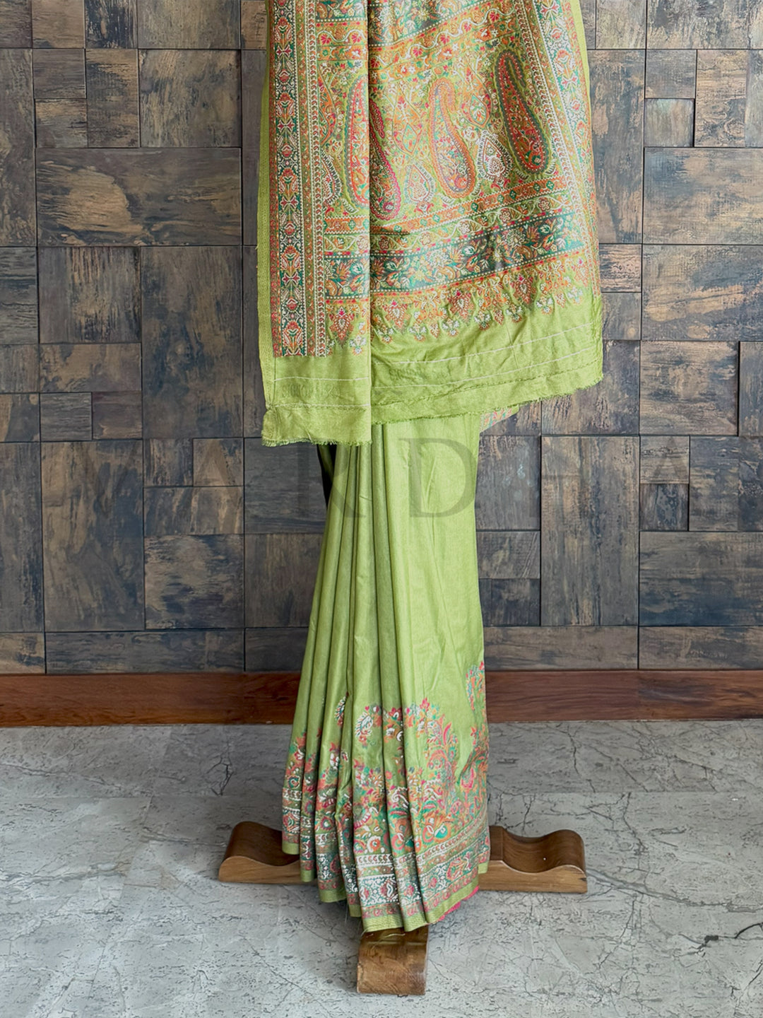 Exquisite mehendi green Pashmina raw silk saree with fine embossed thread detailing, blending traditional artistry with modern elegance.