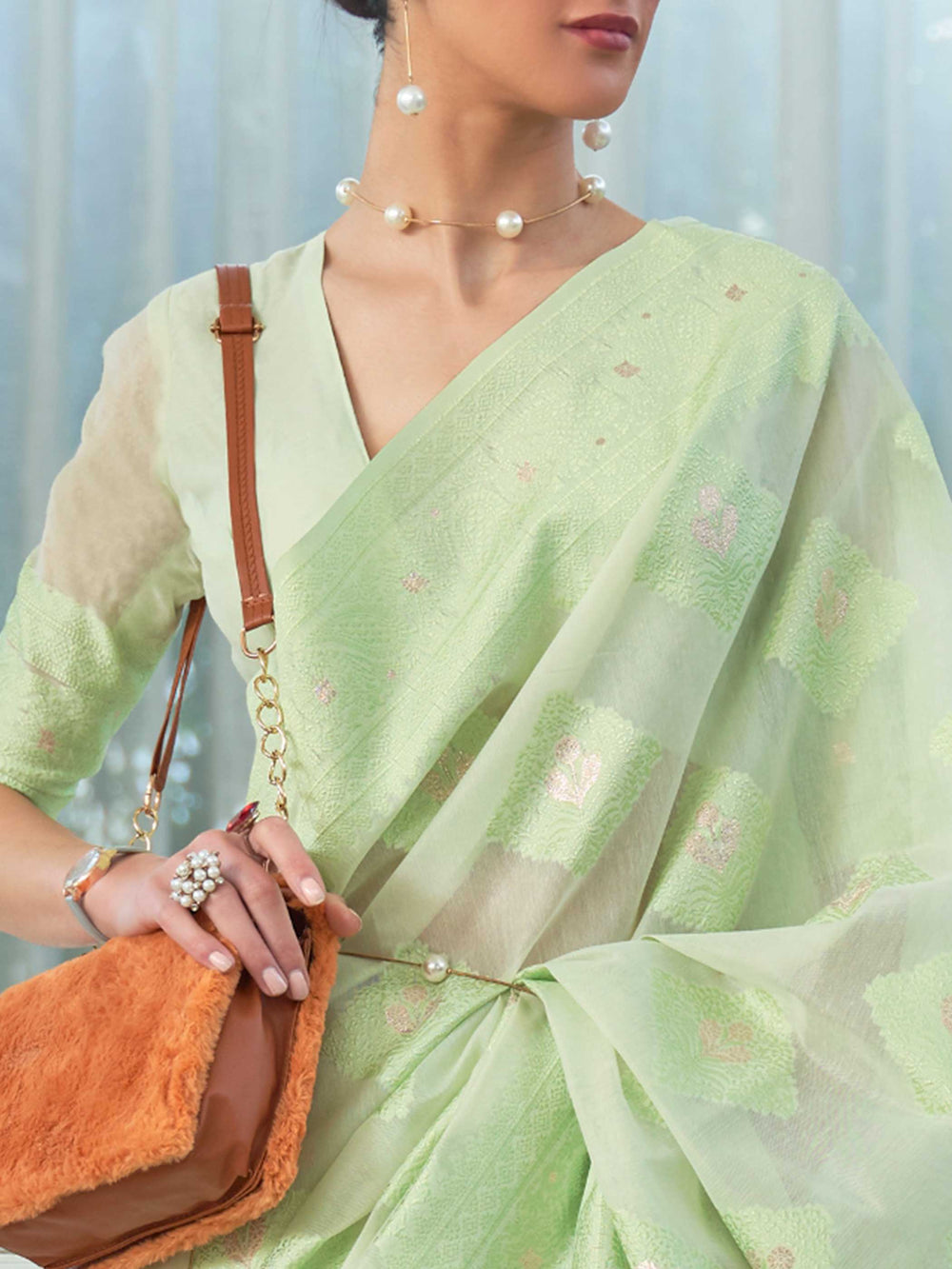 Elegant Mint Green Chikankari Georgette Saree adorned with Intricate Lucknowi Weaving, perfect for Bridal Wear and Cultural Celebrations.

