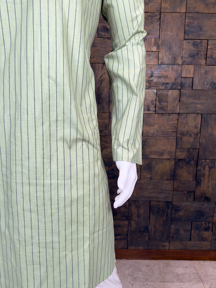 Green striped shirt on a wooden block background
