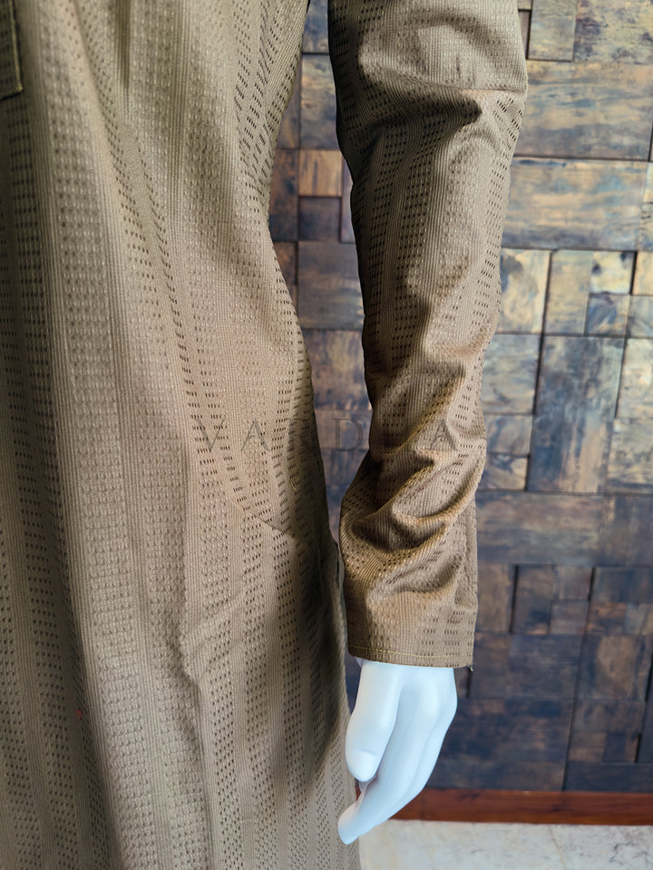 Brown textured coat on a mannequin against a wooden paneled wall. A classic knee-length Long Kurta with full, straight sleeves and a clean hemline.