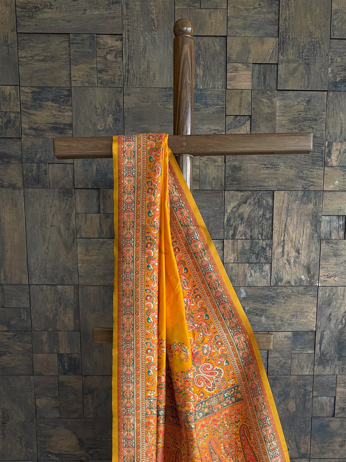 Mustard-yellow raw silk saree with a soft Pashmina texture and exquisite embossed thread detailing, perfect for festive elegance.