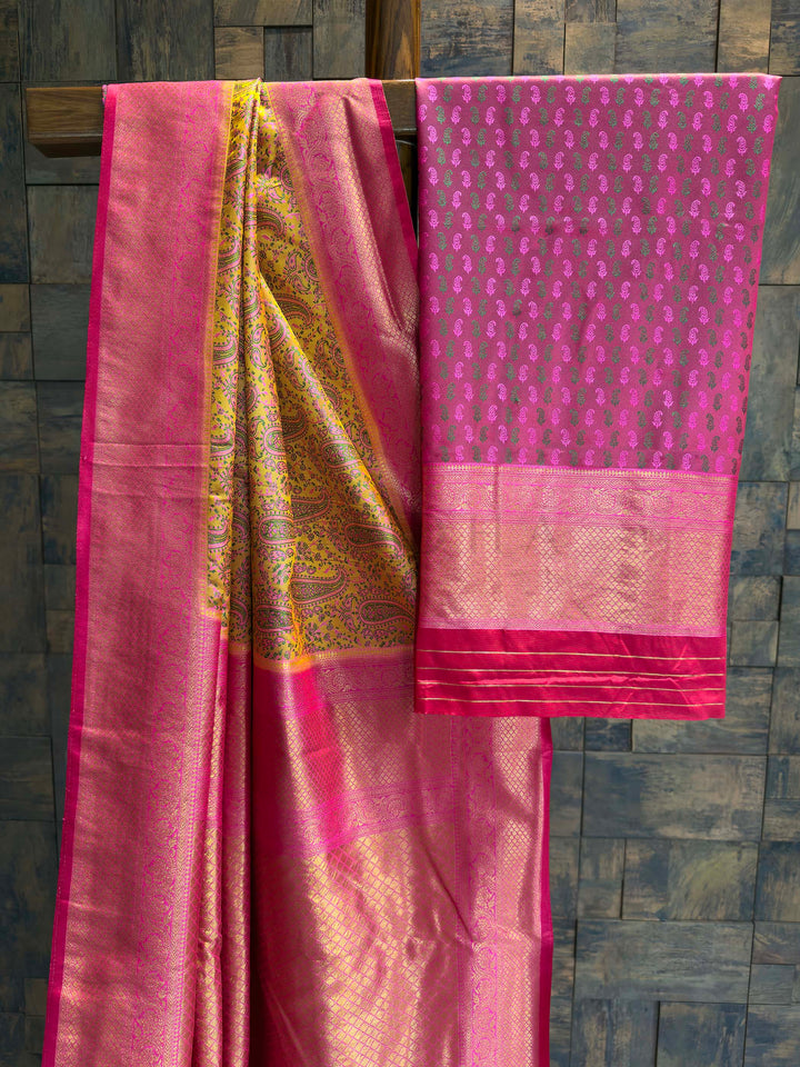Saree with matching Hot Pink blouse piece featuring all-over zari paisley buttis.