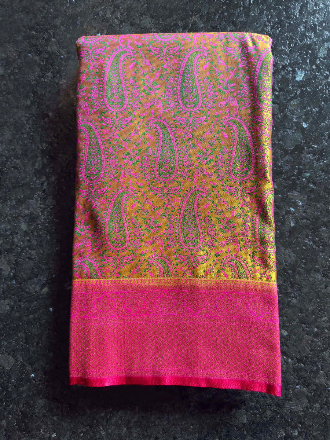 Folded view highlighting the sheen and intricate Tanchoi weave of the satin fabric.