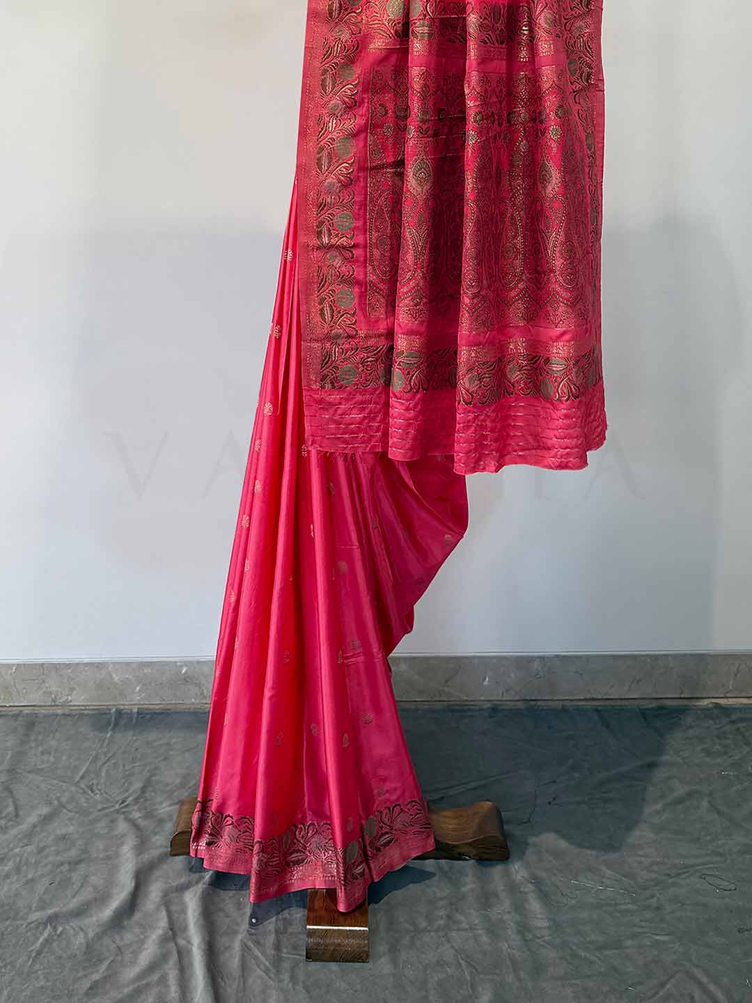 Elegant Neon Fuchsia Jamawar satin saree, with rich patterns and a radiant sheen, perfect for weddings and grand celebrations.