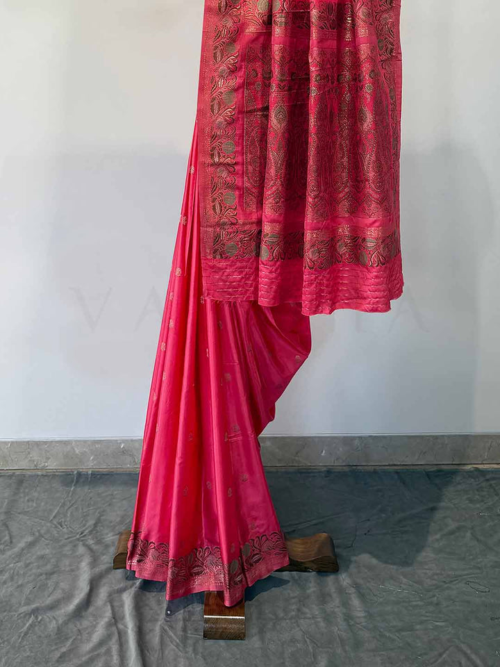 Elegant Neon Fuchsia Jamawar satin saree, with rich patterns and a radiant sheen, perfect for weddings and grand celebrations.