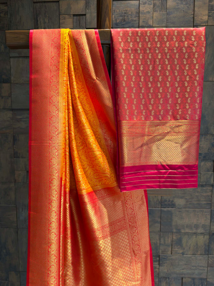 Saree with matching Hot Pink blouse piece featuring all-over zari paisley buttis.