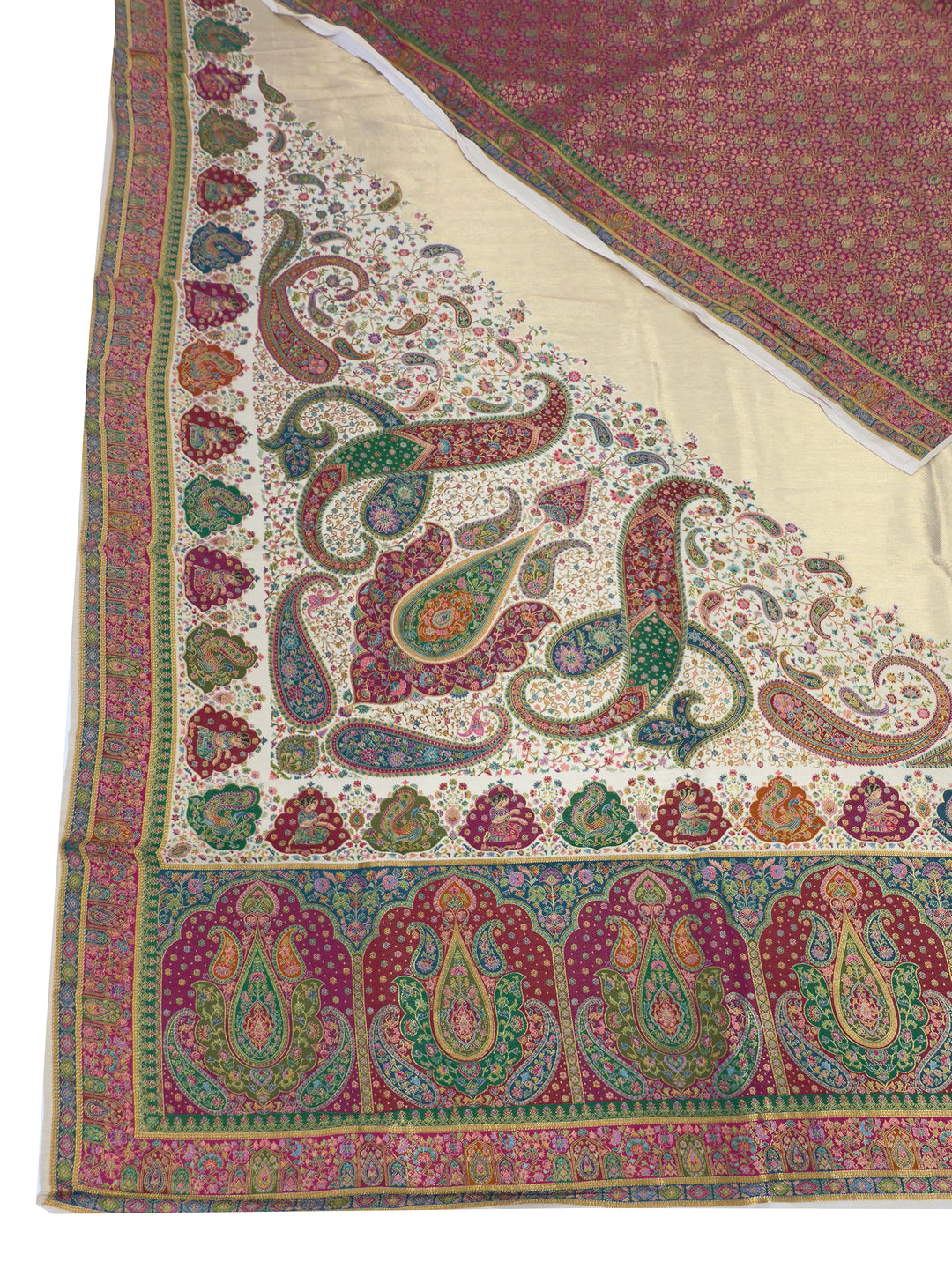 Colorful paisley patterned fabric with a white background