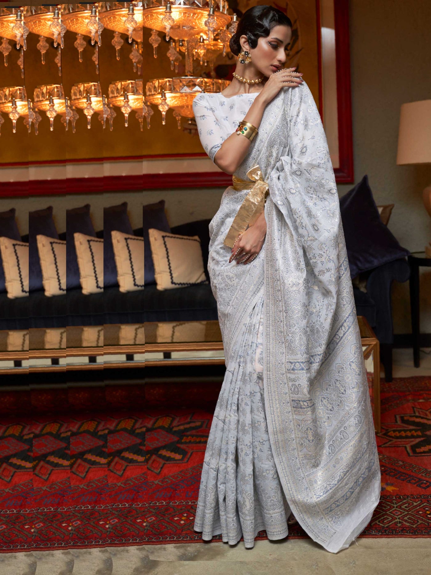 Off White Kashmiri Modal Silk Saree featuring Intricate Floral Weaving and Handloom Craftsmanship, offering a Luxurious Drape for Elegant Occasions.

