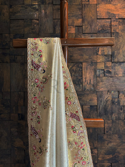 Close-up of floral embroidery and zari detailing with peacock motifs on Off White Kanjivaram Saree.
