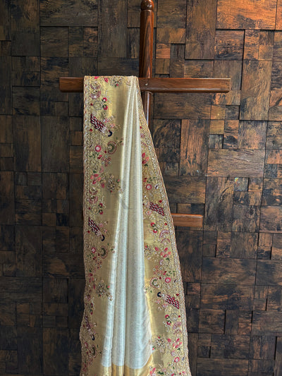 Draped presentation of Off White Kanjivaram Saree with grand peacock and floral patterns.