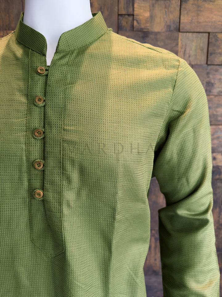 Green kurta on a mannequin against a wooden background. Elegant Olive Green cotton kurta with full sleeves, designed for Mehendi ceremonies, morning pujas, and smart-casual daytime gatherings.