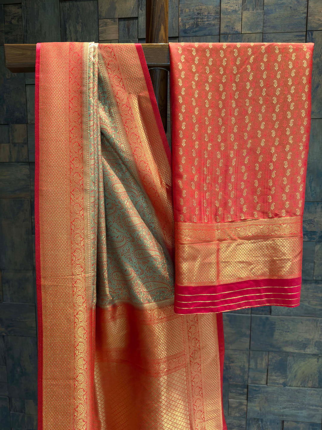 Saree with matching Deep Red blouse piece featuring all-over zari paisley buttis.