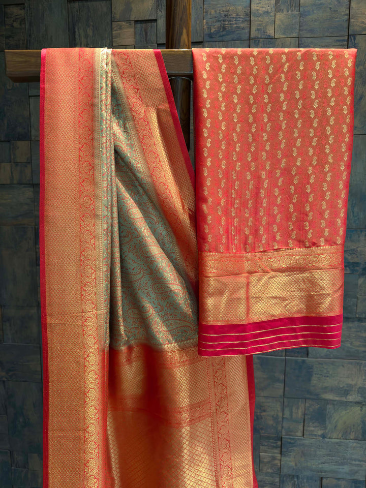 Saree with matching Deep Red blouse piece featuring all-over zari paisley buttis.