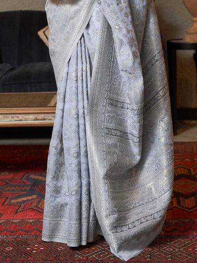 Traditional Pastel Grey Kashmiri Handloom Silk Saree adorned with Exquisite Floral Designs, offering a Graceful Drape and Sophisticated Appeal for Festive Occasions.

