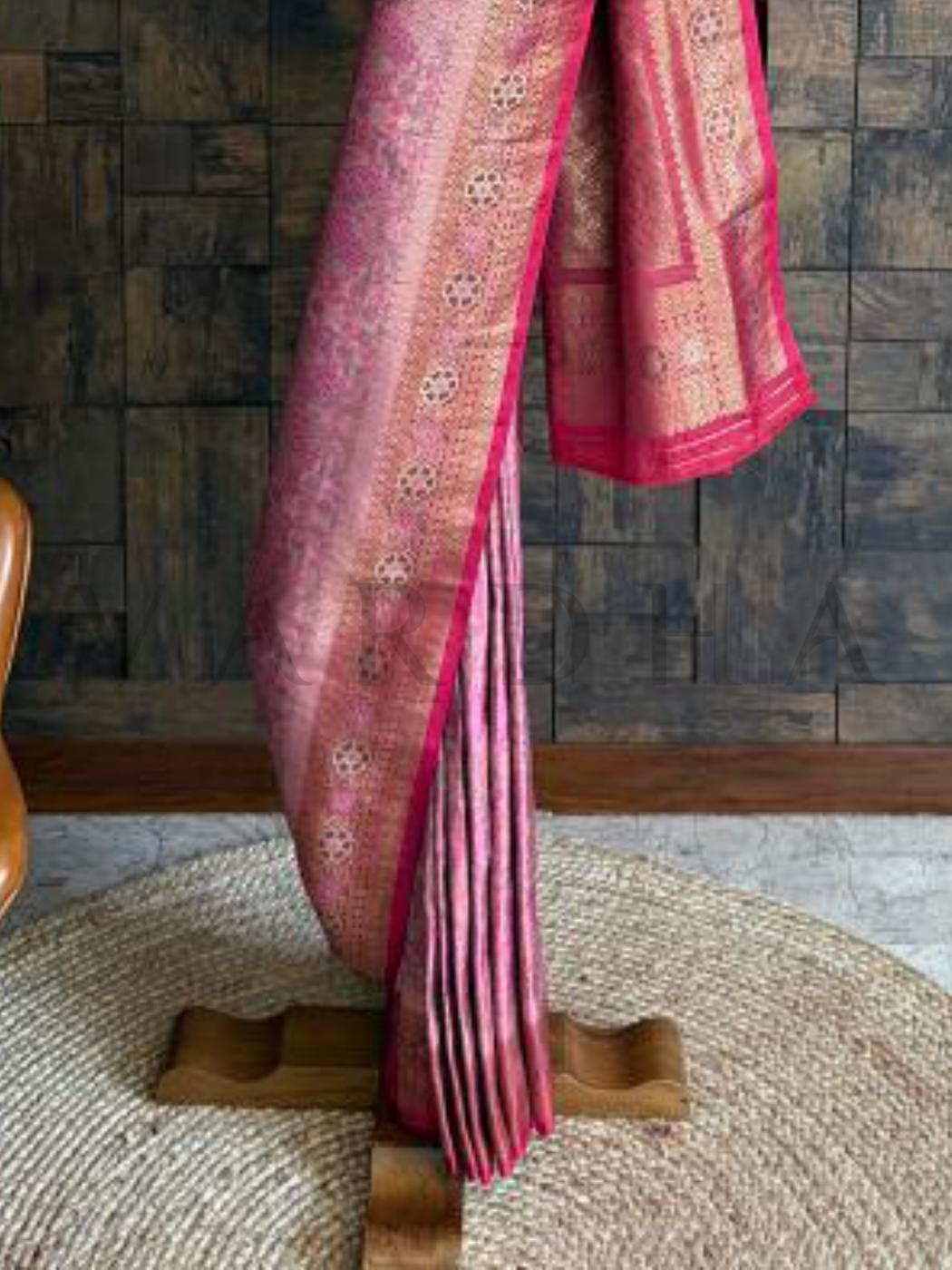 Peacock-themed pink cream Kalamkari saree in art silk, finished with vibrant woven borders. Festive pink saree with unstitched blouse piece, zari borders, and Kalamkari woven look.
