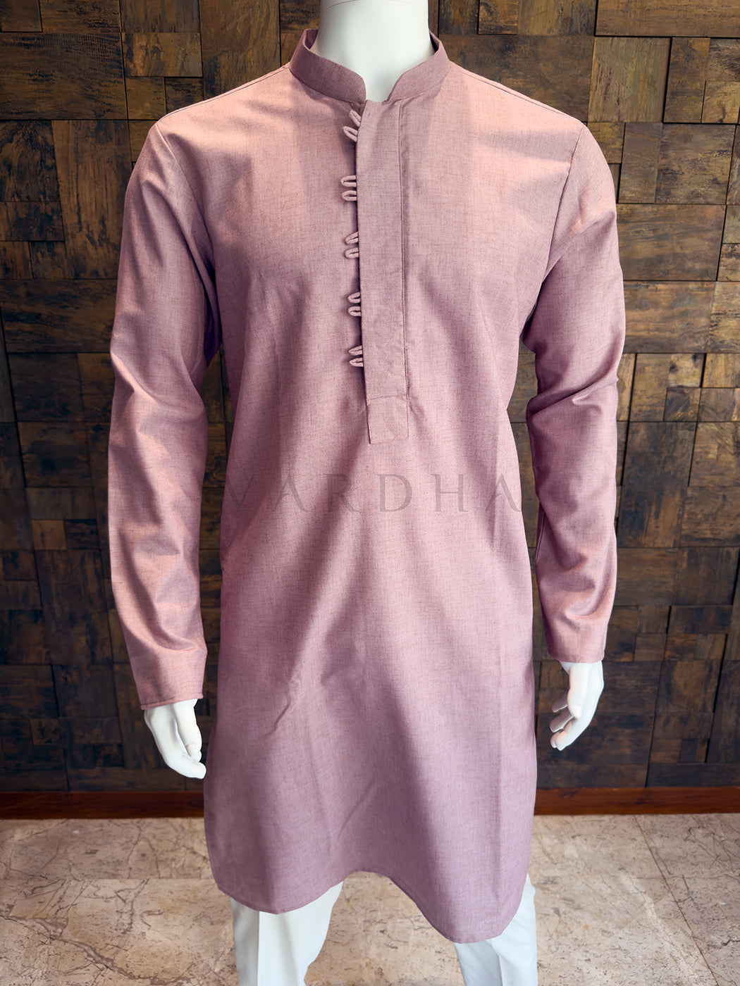 Close-up of the dusty mauve kurta showing the modern asymmetrical stitched placket and mandarin collar.