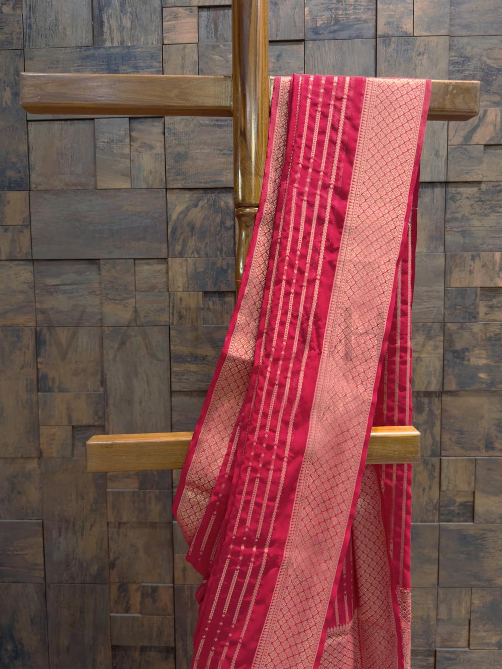 Full view of georgette saree highlighting bandhani-inspired golden lines and light-reflecting featherweight texture Diamond border woven in gold zari with delicate featherlike drape and pleats flowing down to hem