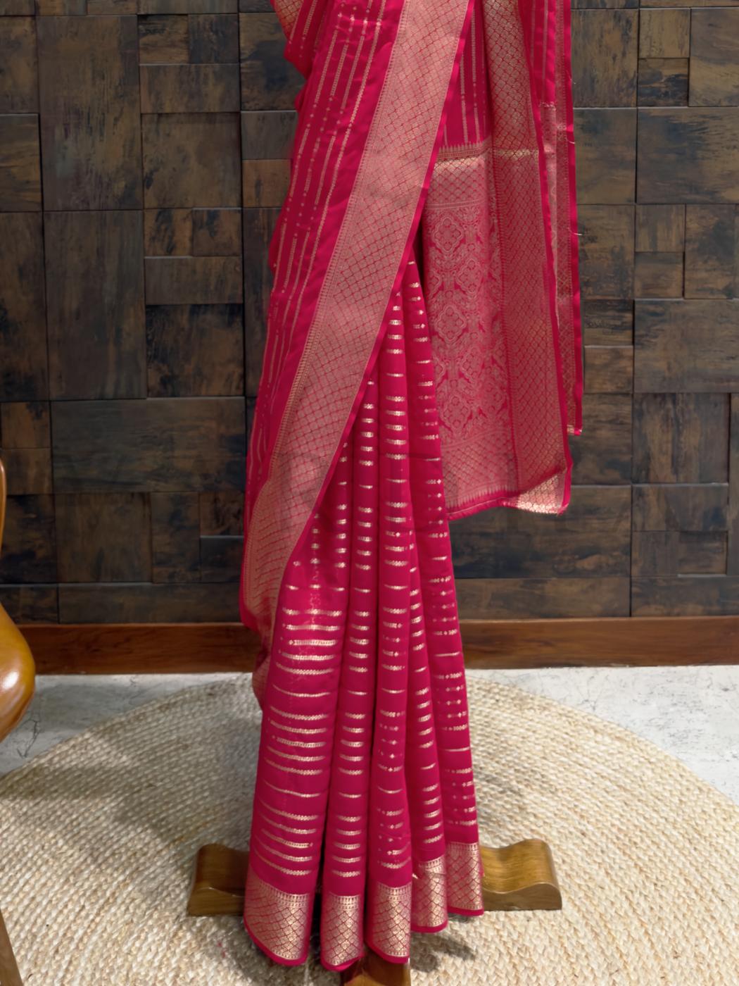 Soft pallu drape in golden weave captured against rich pink backdrop, perfect for heritage-inspired outfits., Matching blouse piece with zari border in rani pink ready to be tailored into traditional or fusion festive wear