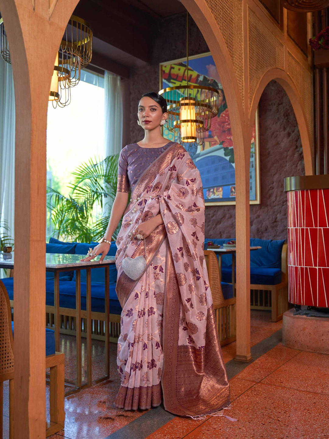 Pink Shimmer Organza Saree with Copper Zari Weaving and Contrast Border, featuring an Exquisite Floral Jangla Design—a perfect blend of Traditional Craftsmanship and Modern Elegance for Festive Occasions. 

