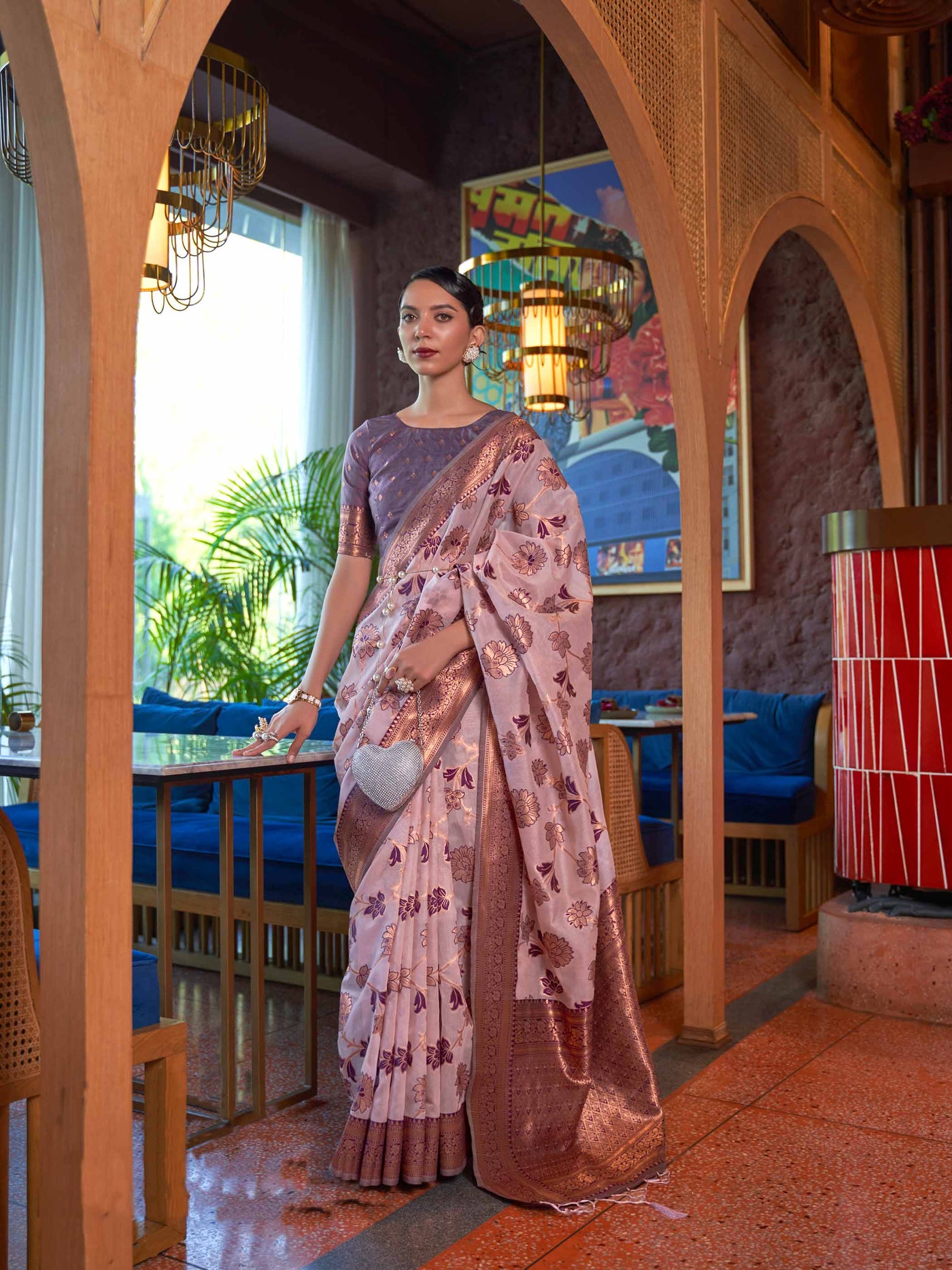 Pink Shimmer Organza Saree with Copper Zari Weaving and Contrast Border, featuring an Exquisite Floral Jangla Design—a perfect blend of Traditional Craftsmanship and Modern Elegance for Festive Occasions. 

