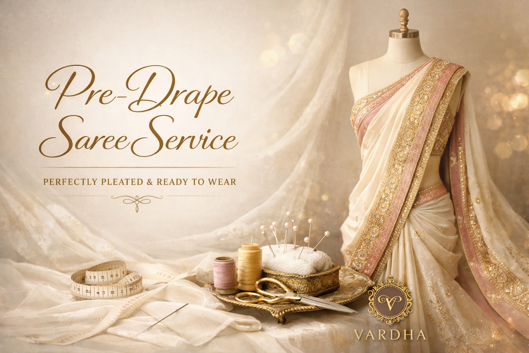 Pre-draped saree with sewing tools on a mannequin, Vardha brand visible