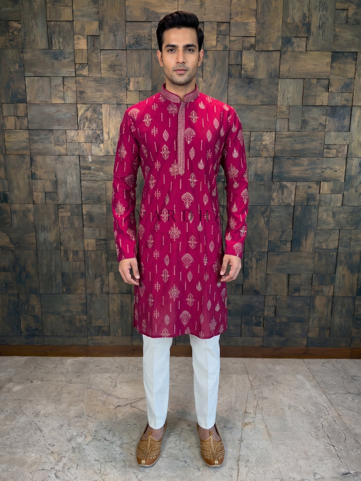  lightweight comfort. It features lavish gold and silver zari embroidery scattered across the body in traditional motifs of Paisleys (Ambi), Geometric Diamonds, and Floral Buttas.