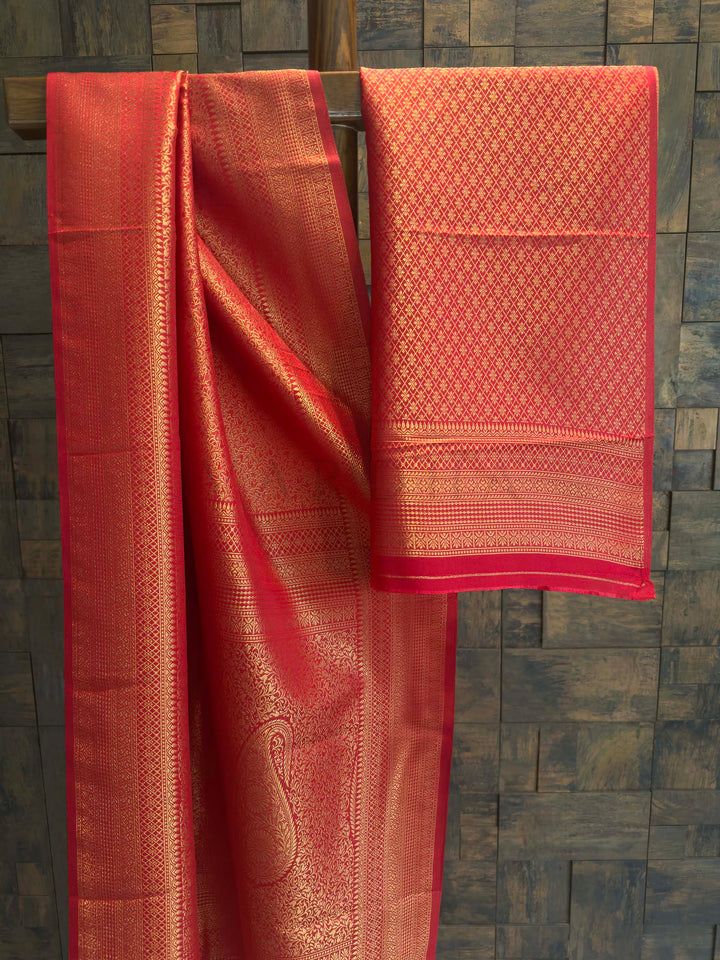 Red Golden Zari Kanjivaram Silk Saree House of Vardha. Authentic Indian ethnic wear featuring a radiant Red Golden Zari Kanjivaram Silk Saree richly woven with golden threads by House of Vardha.