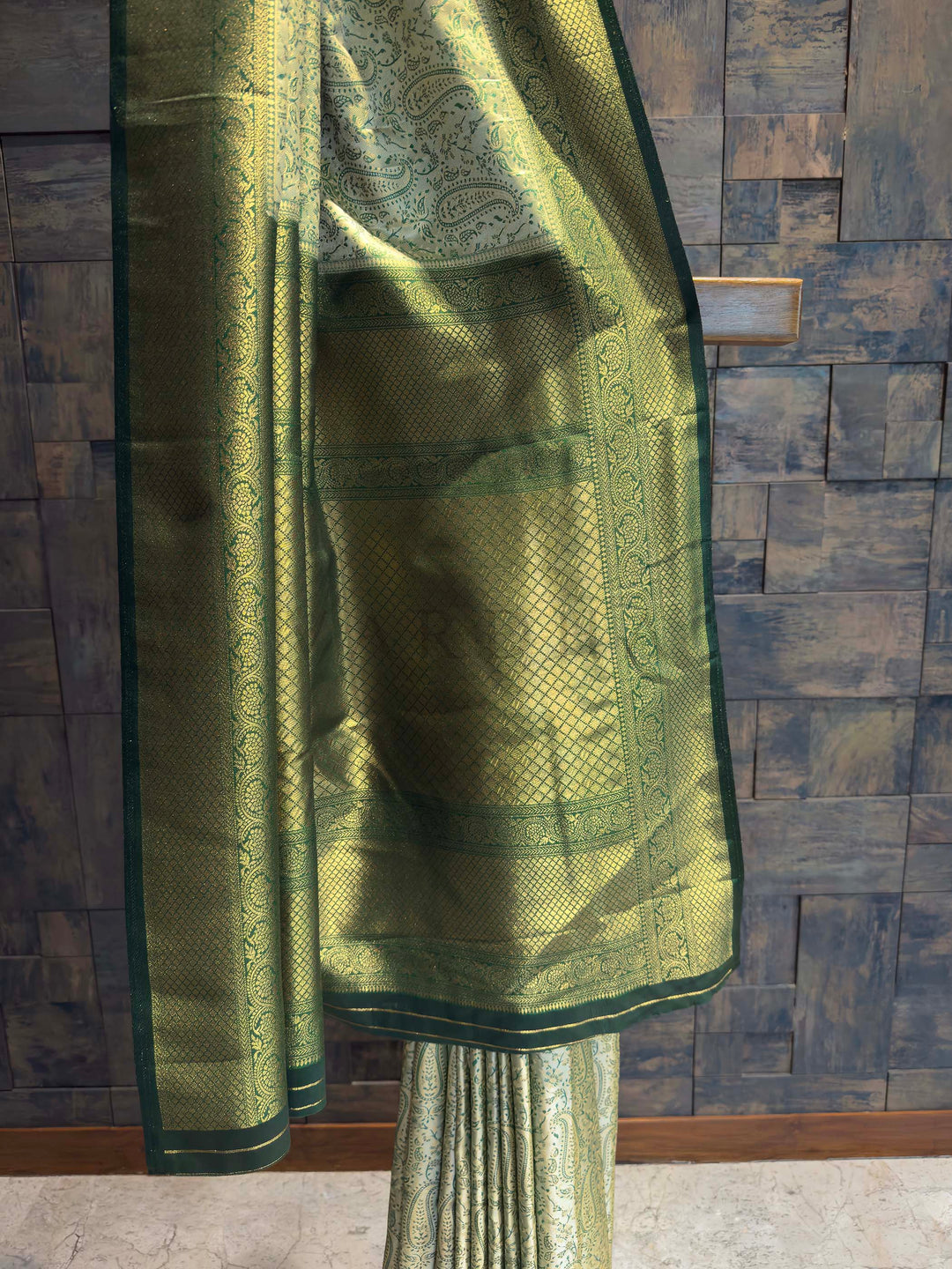 Detail shot of the Forest Green Gold Zari border contrasting with the light body.