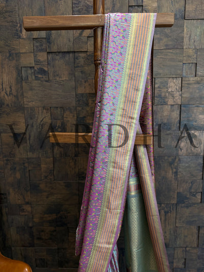 Detailed view of sea green satin silk saree with intricate Tanchoi thread weaving and vibrant parrot motif design