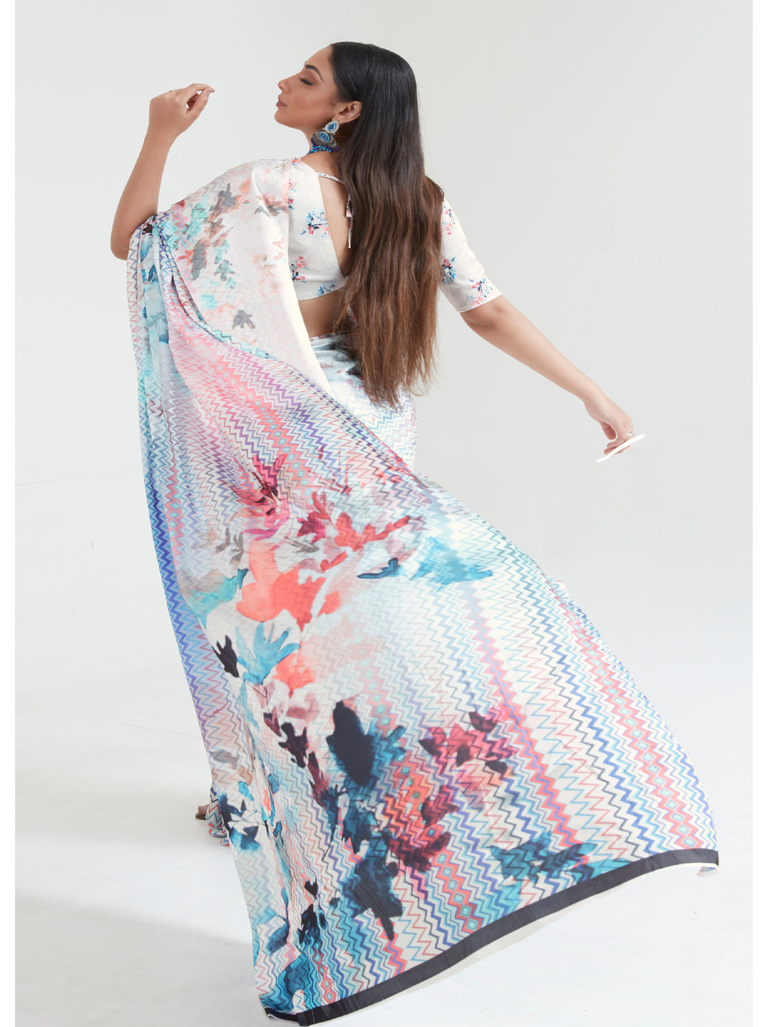 A sky blue and blush pink digital print saree with an elegant drape, perfect for casual and festive wear.
