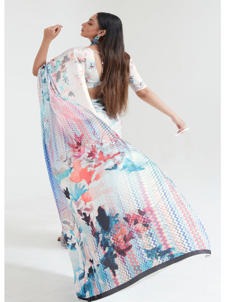 A sky blue and blush pink digital print saree with an elegant drape, perfect for casual and festive wear.