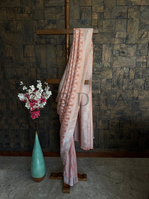 Soft orange georgette saree with chevron motifs and shimmer thread detailing, ideal for festive daywear