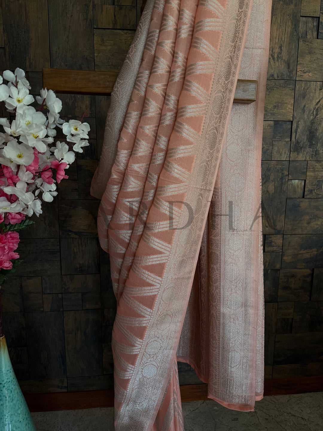 Georgette saree with chevron weave, sequin-like embroidery, and soft shimmer finish for Haldi or temple occasions