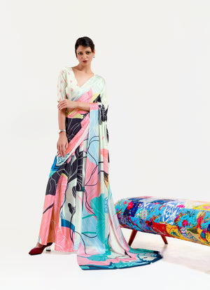 Elegant black and pastel green-white crepe saree featuring digital floral prints and Bollywood-style drape, ideal for cultural celebrations.