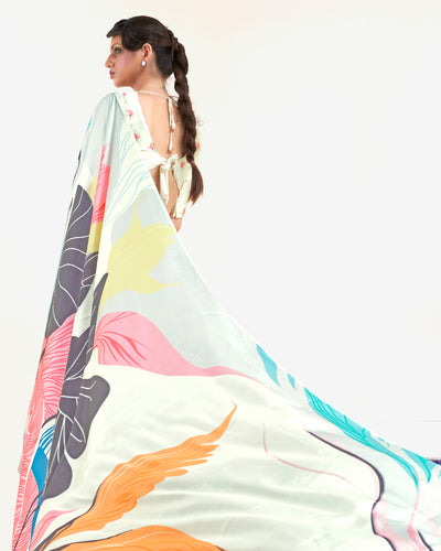Modern black and pastel green-white crepe saree with digital floral prints and Bollywood-inspired drape, perfect for celebratory events.