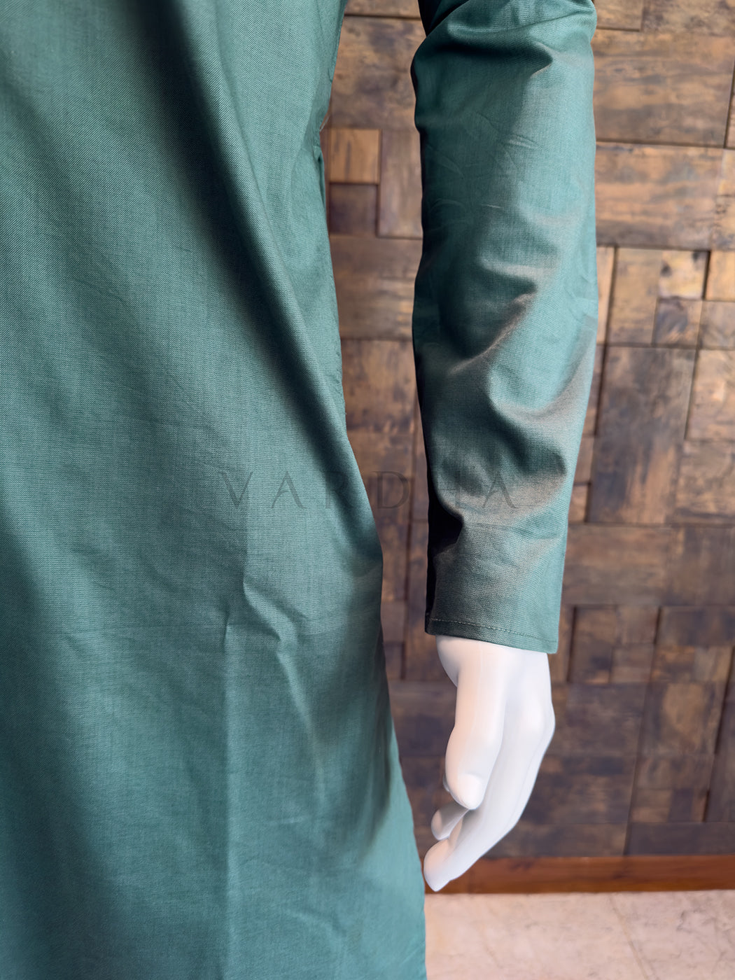 teal blue fabric with a brand name on a wooden background. Men&