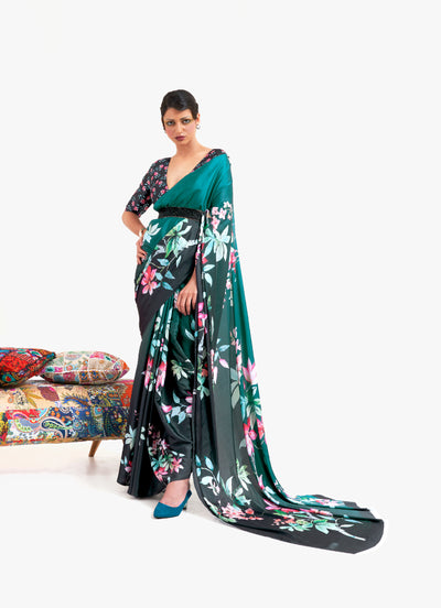Teal green and black digital printed soft crepe saree with Bollywood-style drape and floral patterns, perfect for festive occasions.