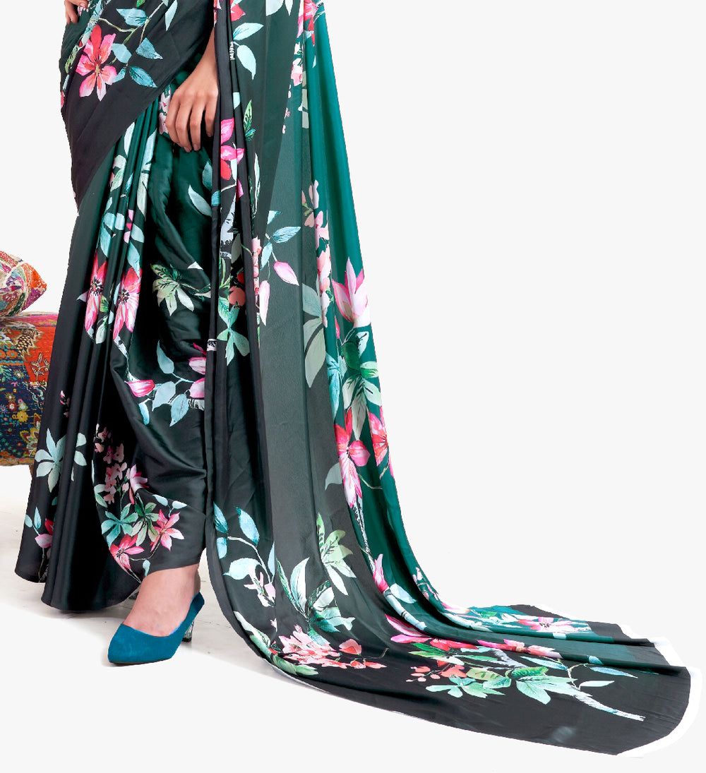 Designer teal green-black crepe saree featuring digital floral prints and Bollywood-inspired drape, ideal for cultural celebrations.