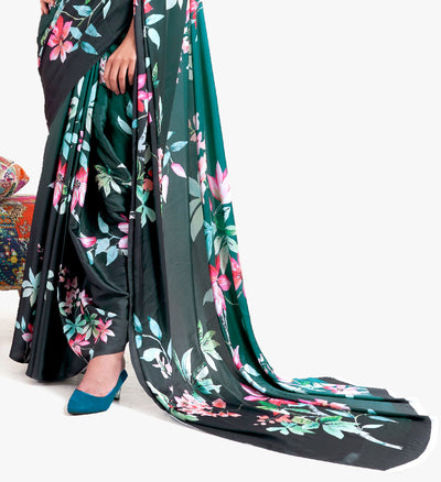 Designer teal green-black crepe saree featuring digital floral prints and Bollywood-inspired drape, ideal for cultural celebrations.