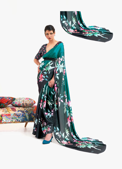 Stylish teal green and black crepe saree showcasing digital floral patterns and Bollywood-inspired drape, ideal for traditional functions.