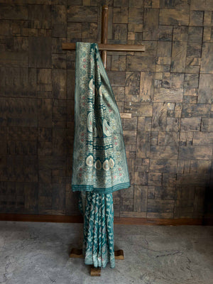 Teal Green Lucknowi Chikankari Silk Saree featuring Intricate Weaving and an Entrancing Blouse, ideal for Festive Occasions and Cultural Celebrations. 
