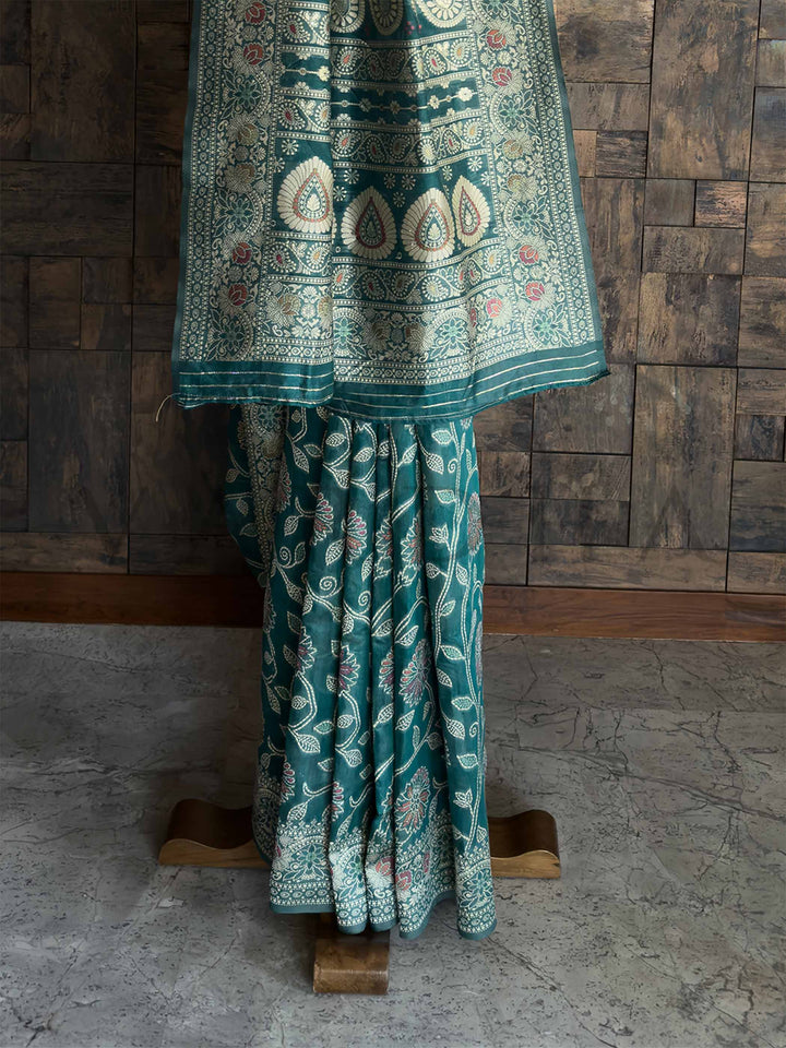 Handcrafted Teal Green Chikankari Saree with Detailed Floral Patterns and an Entrancing Blouse, showcasing Authentic Lucknowi Craftsmanship for Elegant Parties.

