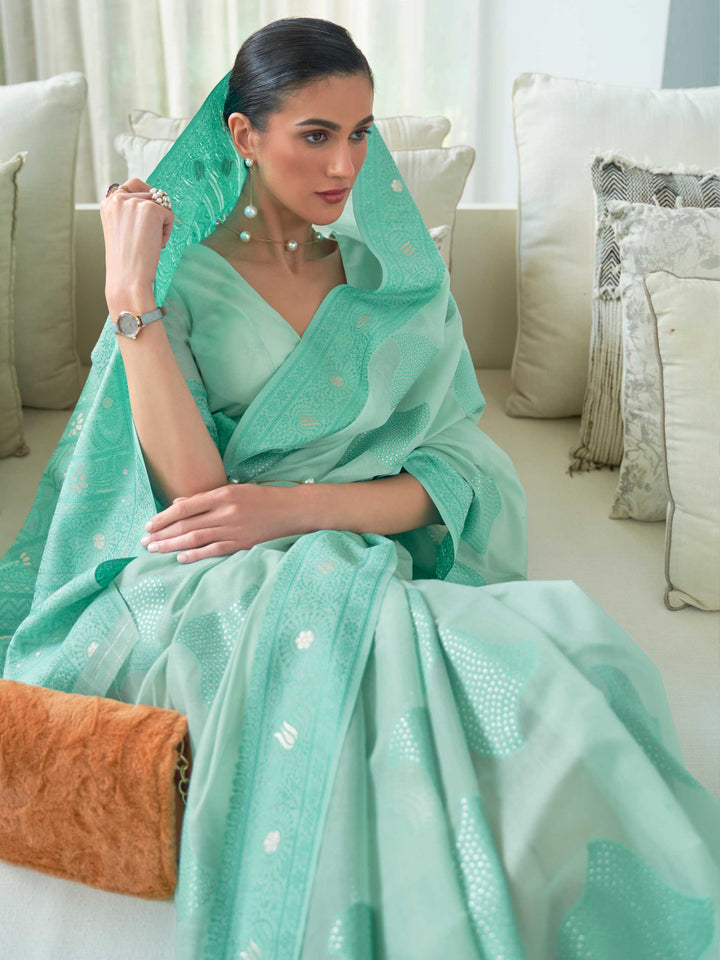 Luxurious Turquoise Lucknowi Chikankari Silk Saree showcasing Delicate Hand Embroidery, an excellent choice for Festive Gatherings and Special Occasions.

