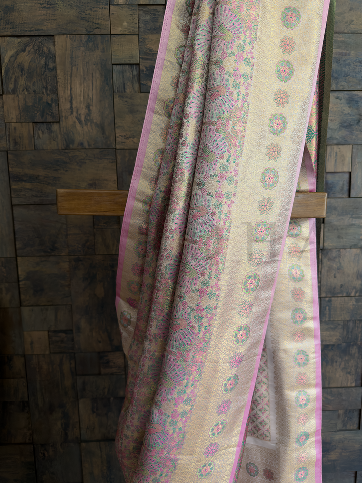 Intricate floral motifs on soft art silk base in pastel white and rose with woven elegance. White Kalamkari Art Silk Saree with contrast blouse and zari detailing, ideal for gifting.
