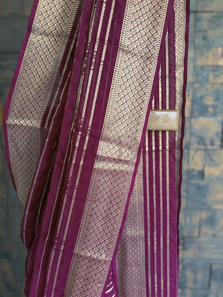 Wine color georgette saree featuring fine zari stripes and diamond threadwork, perfect for pooja and cultural functions