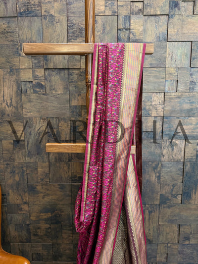 Handwoven wine silk saree with gold border and soft satin texture
Tanchoi weave wine saree with brocade pattern perfect for festive wear
