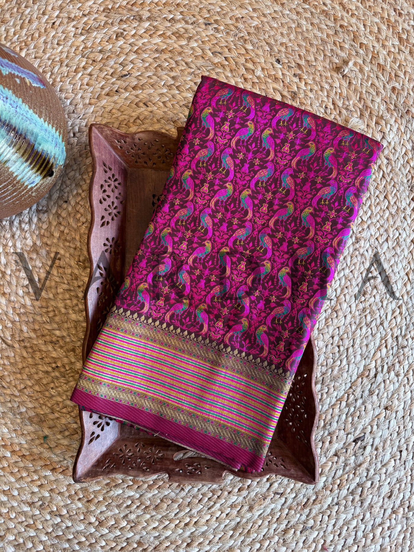 Rich wine and gold saree made of Tanchoi silk featuring elegant threadwork	Luxurious wine color saree in satin base with traditional gold brocade work
