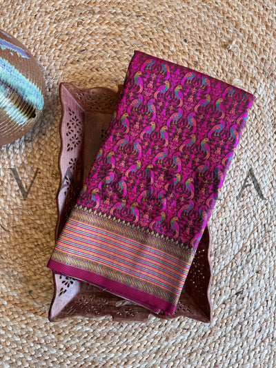 Rich wine and gold saree made of Tanchoi silk featuring elegant threadwork	Luxurious wine color saree in satin base with traditional gold brocade work
